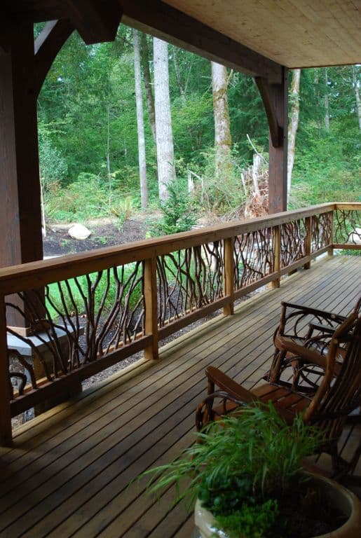 A timber-frame porch with a wooden handrail