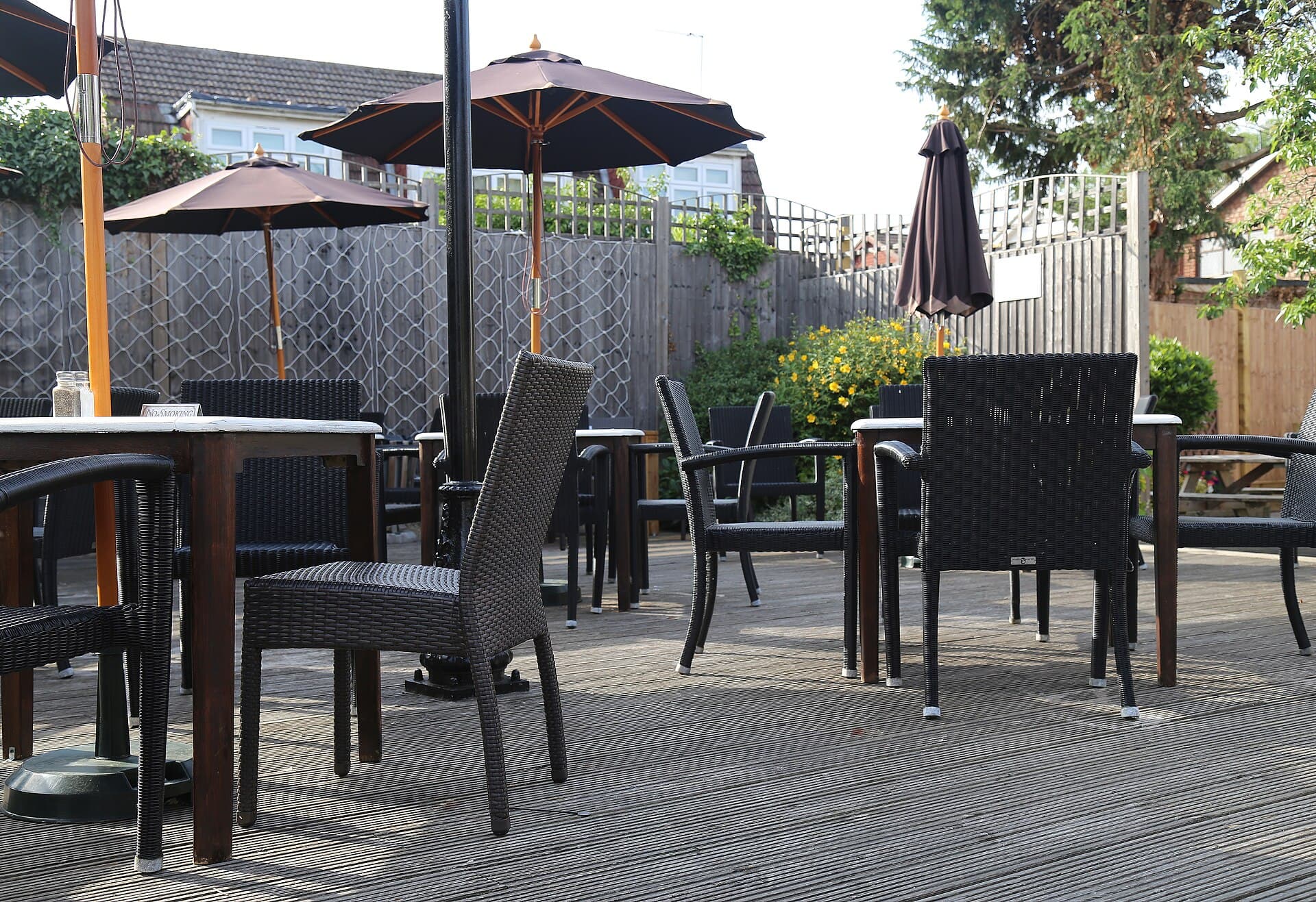 A raised timber deck with outdoor furniture